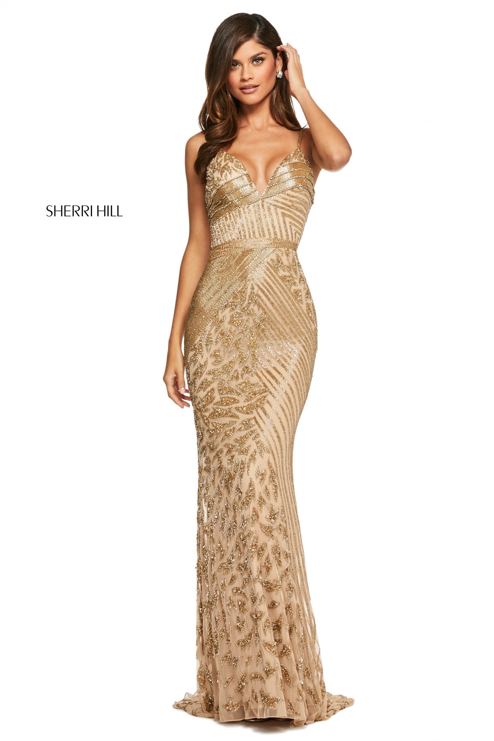 Model wearing a gold Sherri Hill prom dress