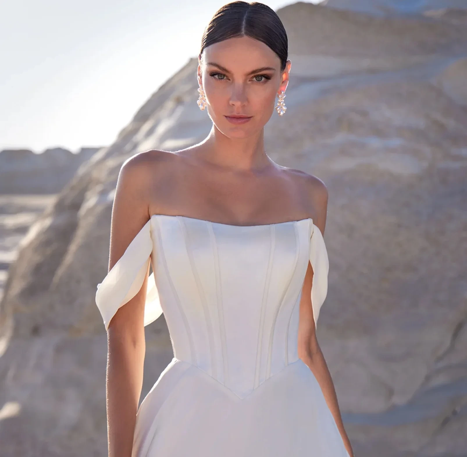 Model wearing a white Madison James dress