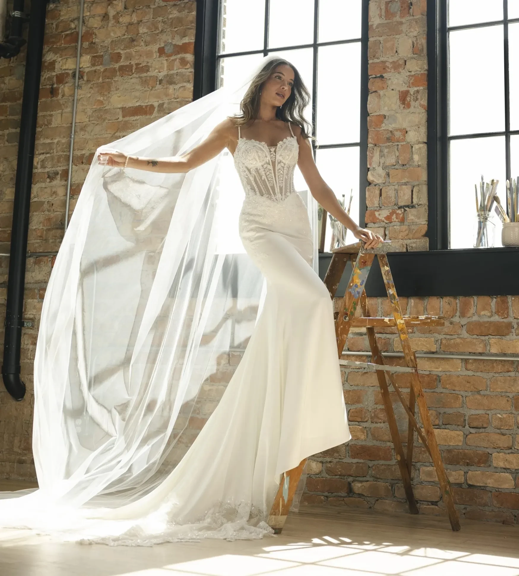 Model wearing a white Maggie Sottero dress