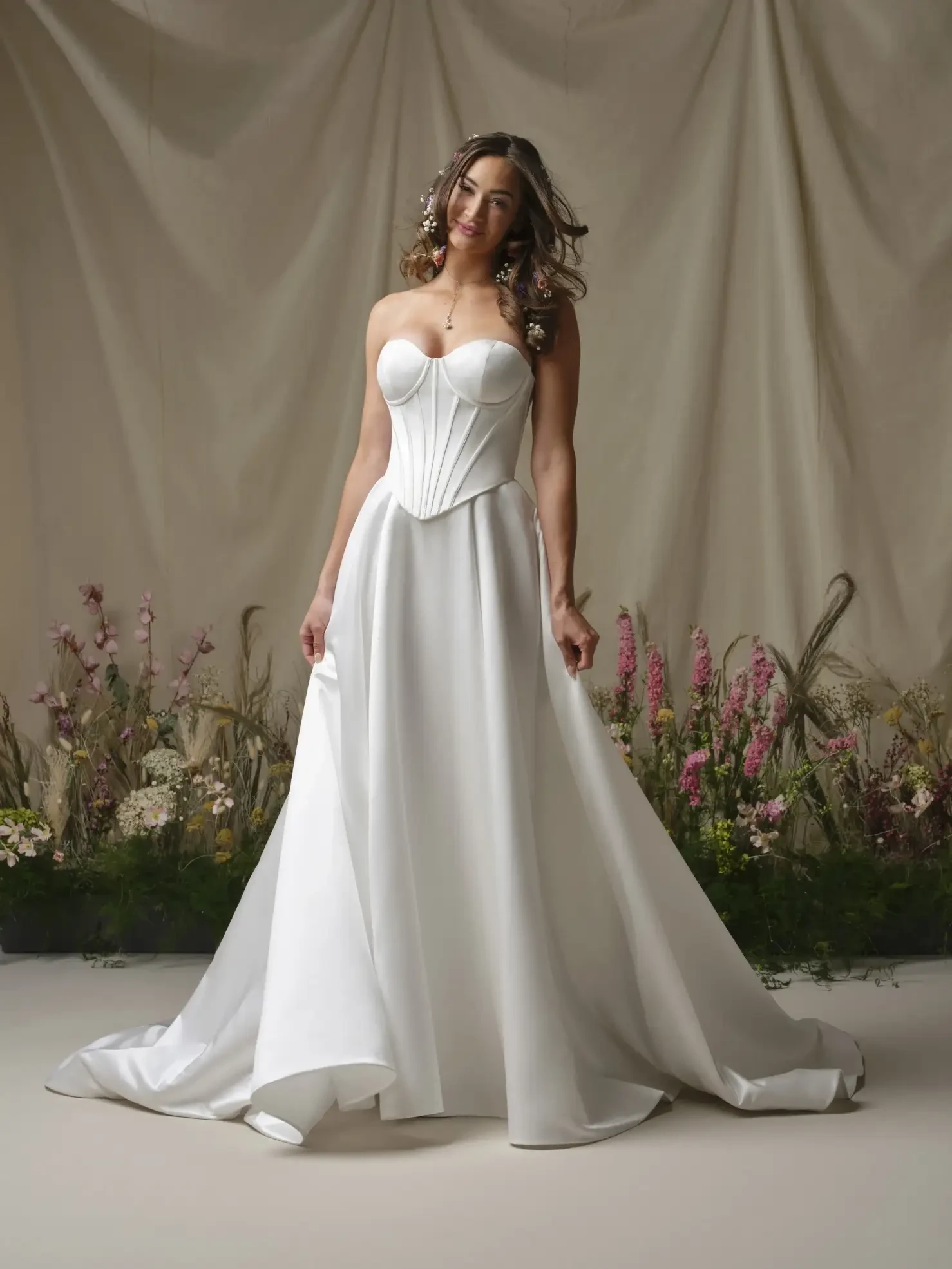 Model wearing a white Rebecca Ingram dress