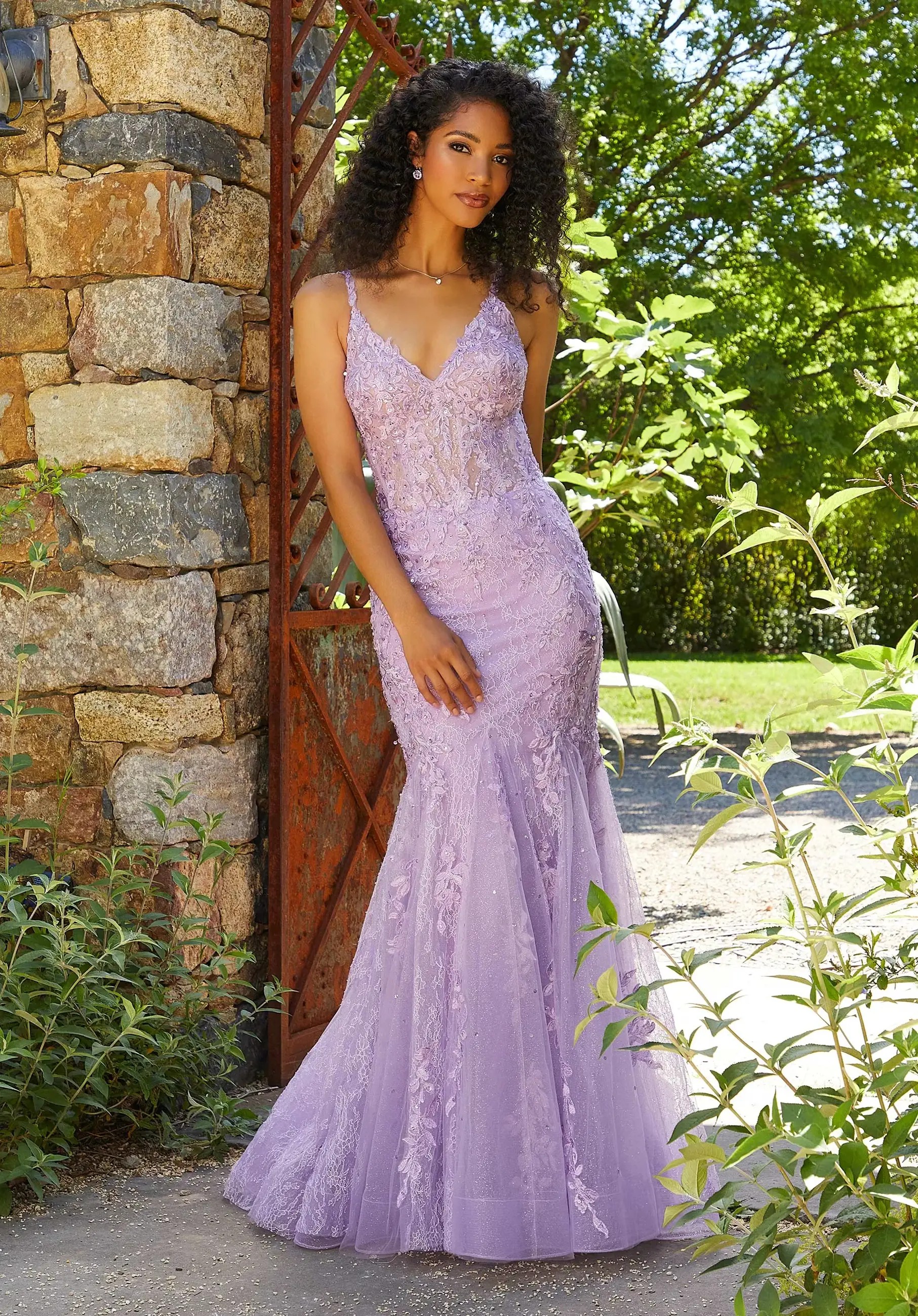 Model wearing a white Morilee prom dress